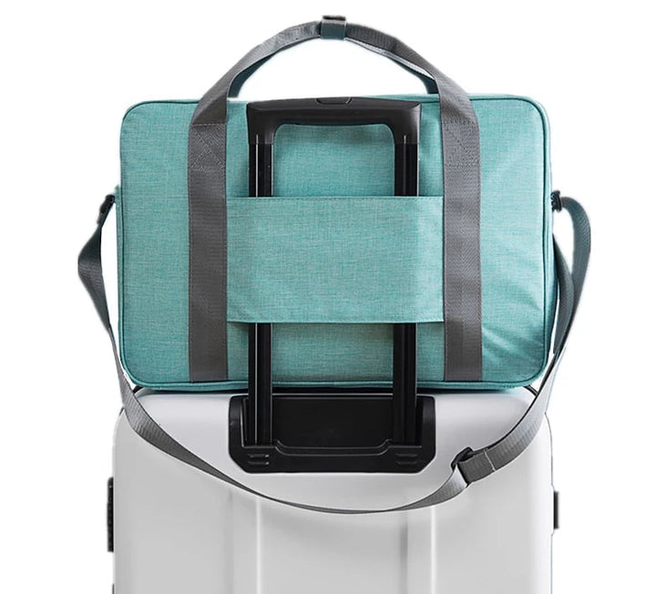 Unisex universal carry-on travel bag designed to attach to suitcases, offering hands-free & organized travel.