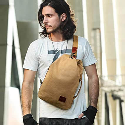 Heavy-duty canvas crossbody bag, water-resistant and anti-theft for secure unisex travel.