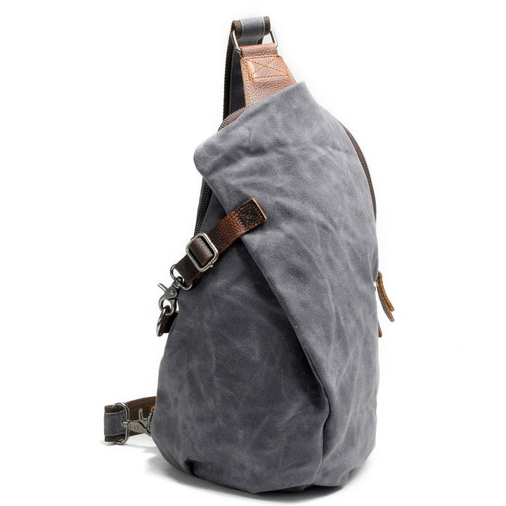 Adventure-ready water-resistant canvas shoulder bag, durable & anti-theft for day trips.