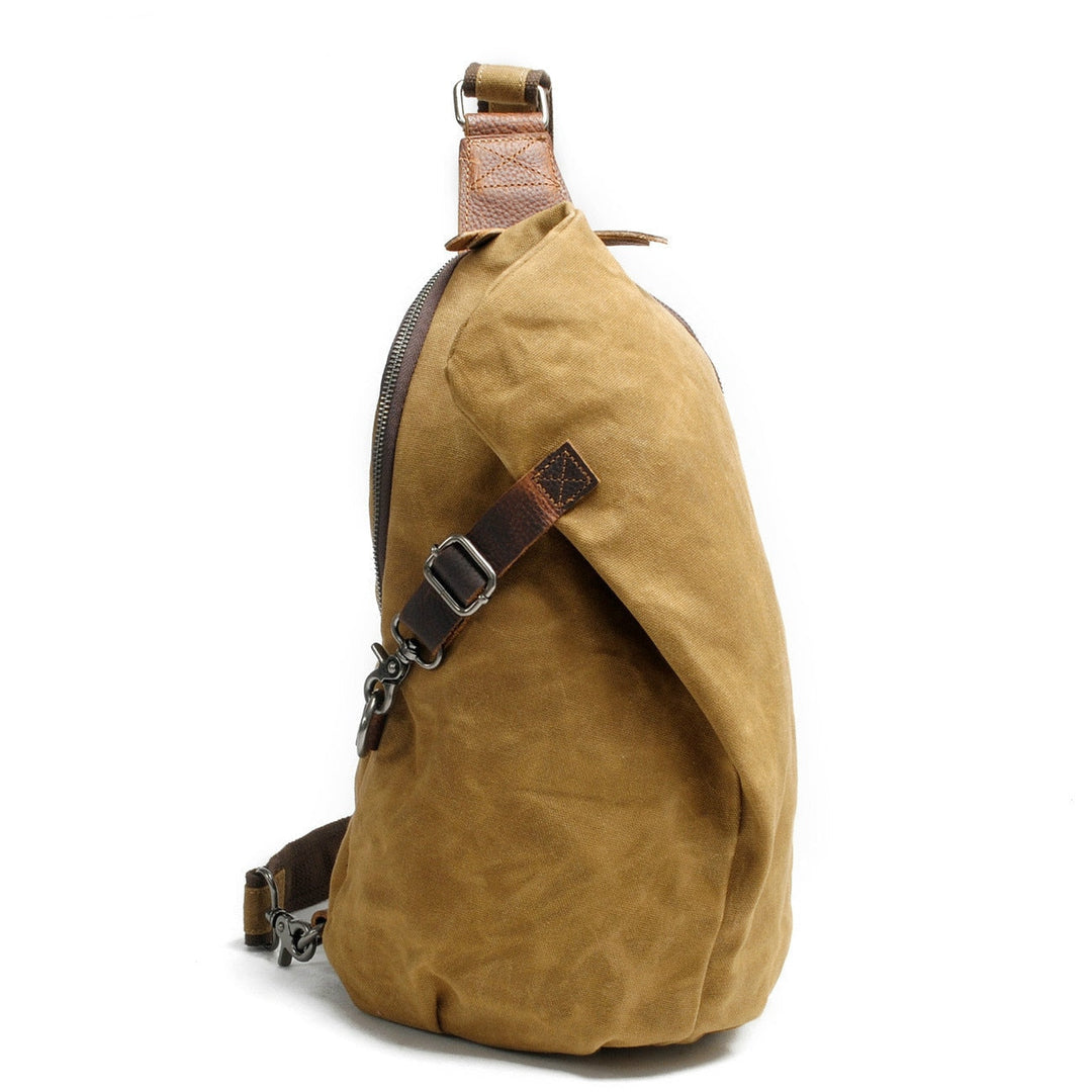 Durable water-resistant canvas crossbody messenger bag with anti-theft pocket, unisex design.