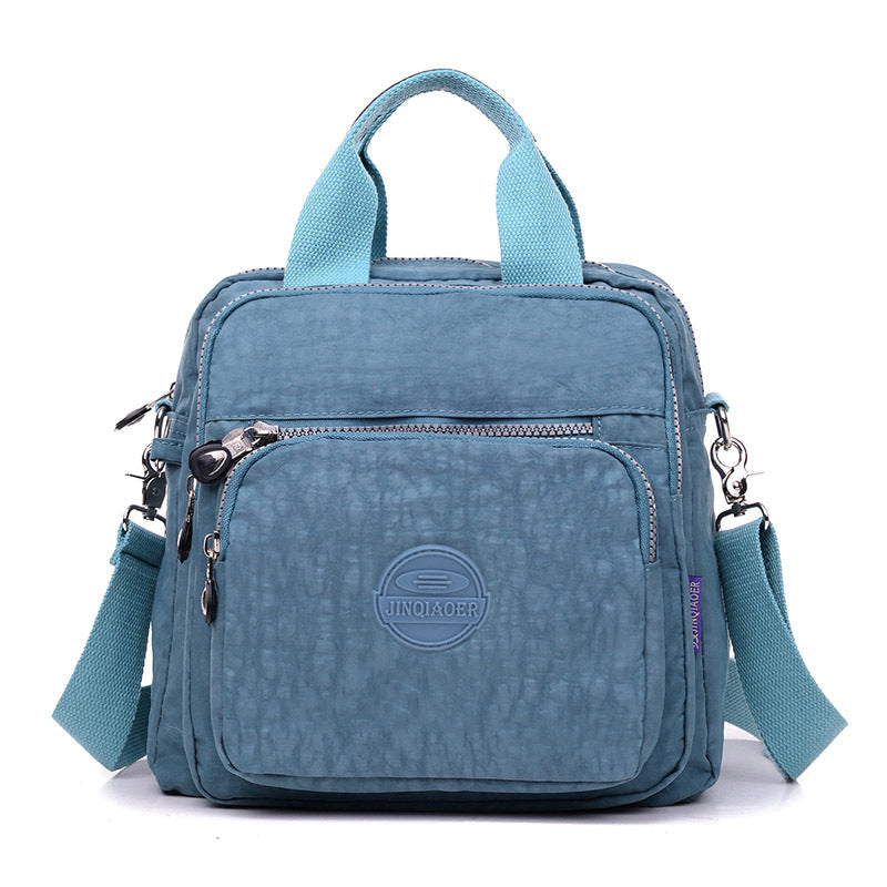 Water-resistant crossbody bag in a vibrant color, appealing to both men and women, a versatile daily essential.