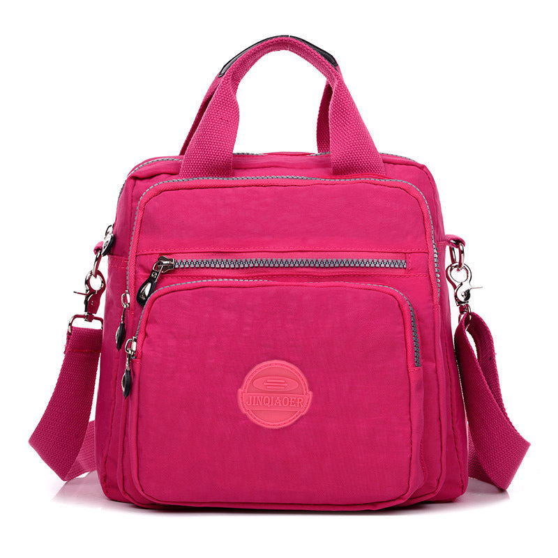 Detail of the zipper and pull on the water-resistant crossbody bag, emphasizing its quality and ease of use.