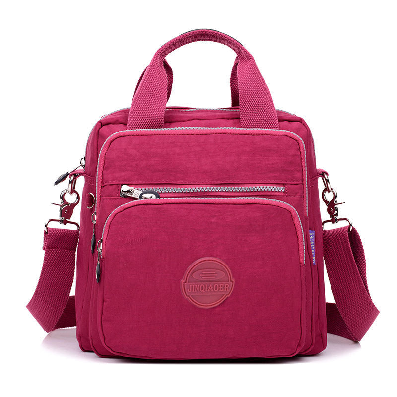 Unisex fashion accessory: water-resistant crossbody bag, styled with casual outfit, ready for urban exploration.