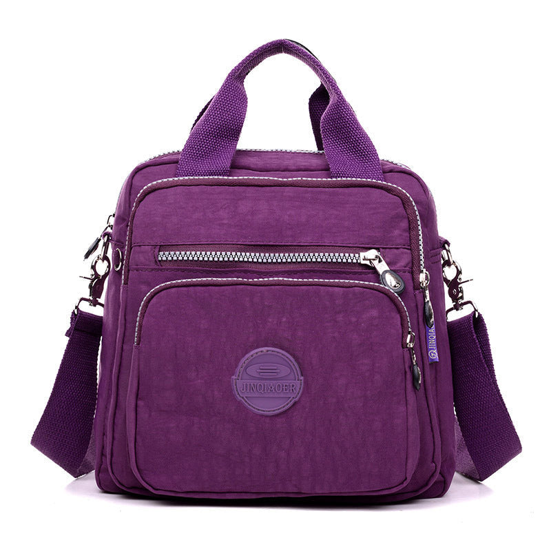 Inside view of the messenger bag, revealing organizational pockets and ample space for travel necessities.