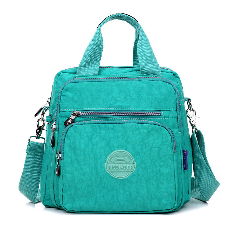 Close-up of the adjustable strap and buckle on the water-resistant crossbody bag, ensuring comfort and fit.
