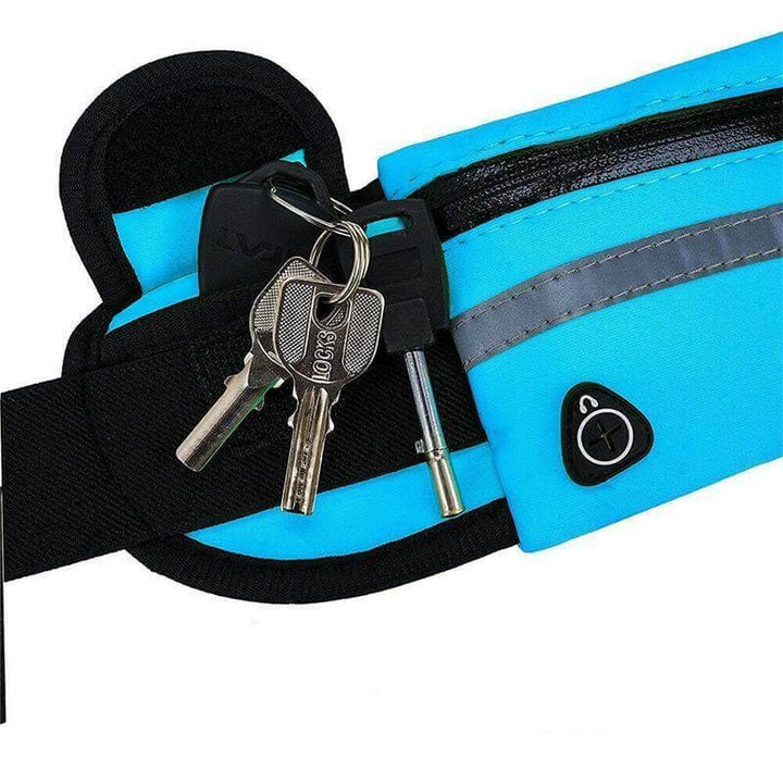 Jogger wearing a water-resistant running belt with phone holder for active sports & exercise.