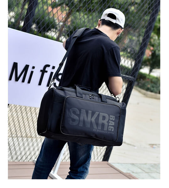Functional unisex water-resistant gear bag with adjustable dividers for shoes, clothes, and tech.