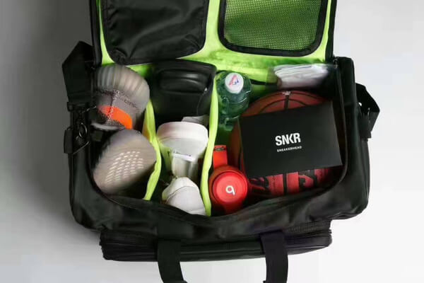 Modern unisex water-resistant sports bag. Adjustable dividers for sneakers, clothing, & accessories.