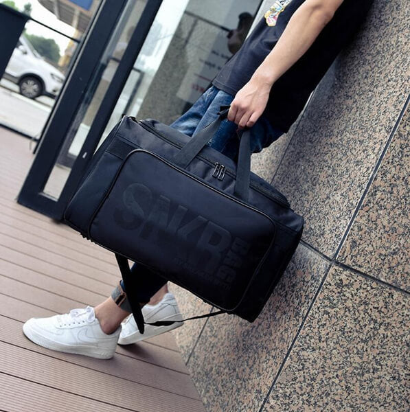 Heavy-duty water-resistant travel duffel for sneakers & sports gear. Adjustable internal dividers.