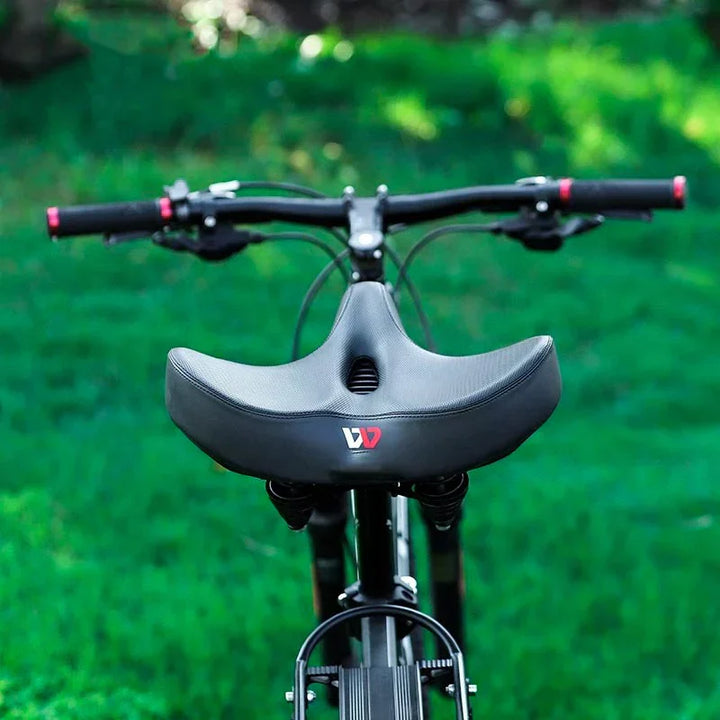 Enhanced comfort wide bicycle saddle, black, featuring shock-absorbing technology for longer rides