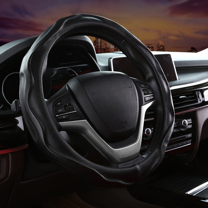 Elegant burgundy PU leather steering wheel cover, non-slip grip for comfort and auto protection.