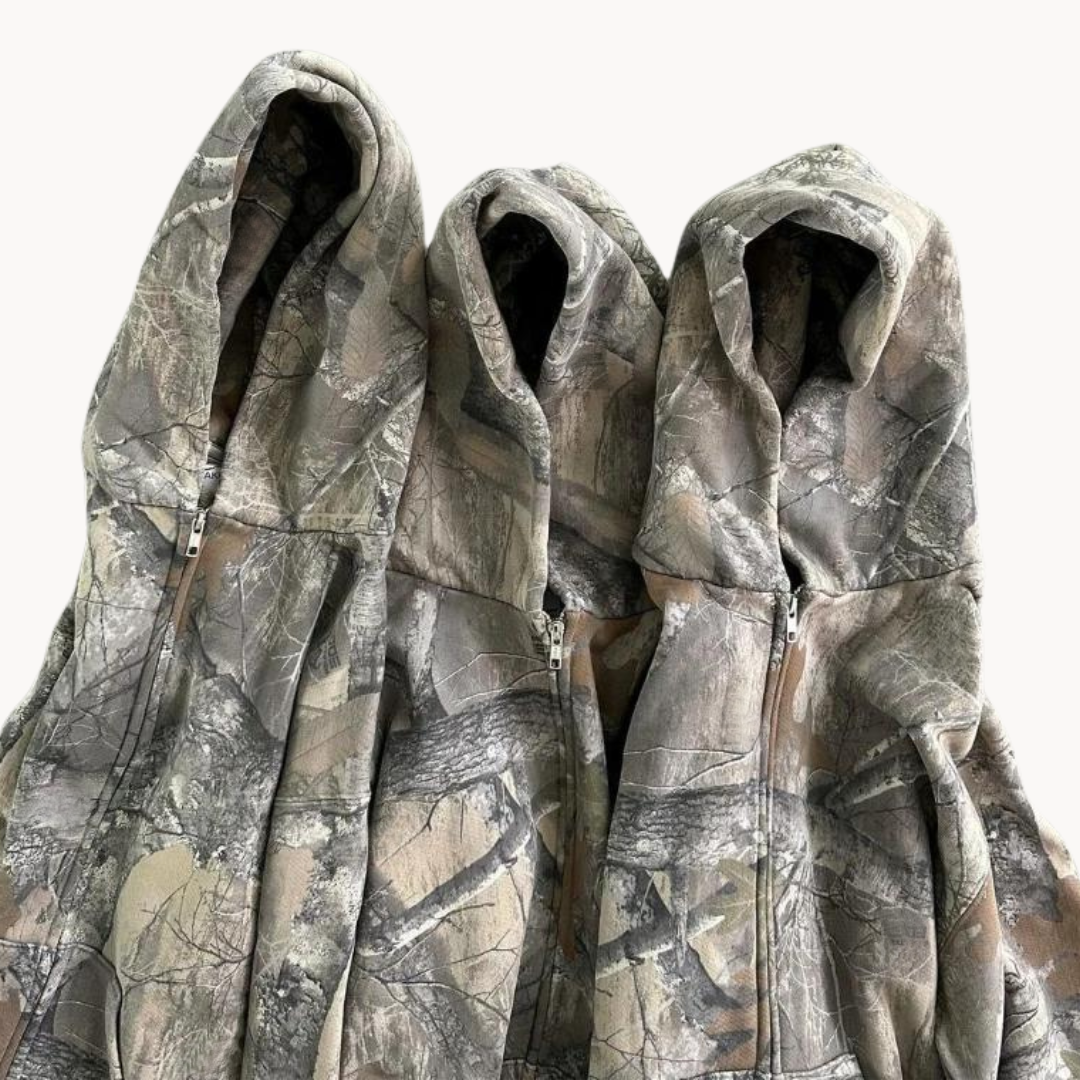 Trendy urban camouflage hoodie, oversized unisex fit, ideal for modern streetwear fashion.
