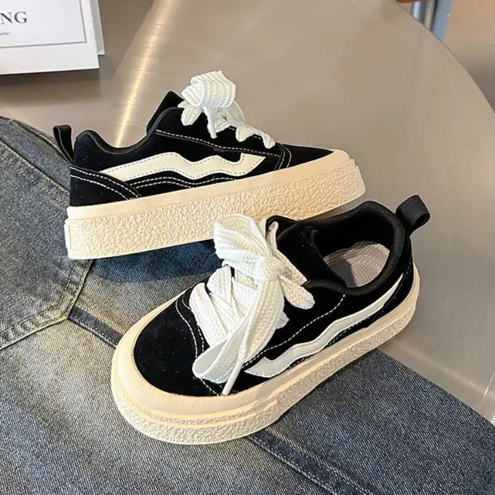 Playful children's fashion sneakers with easy elastic laces, perfect for active kids' comfort and style.