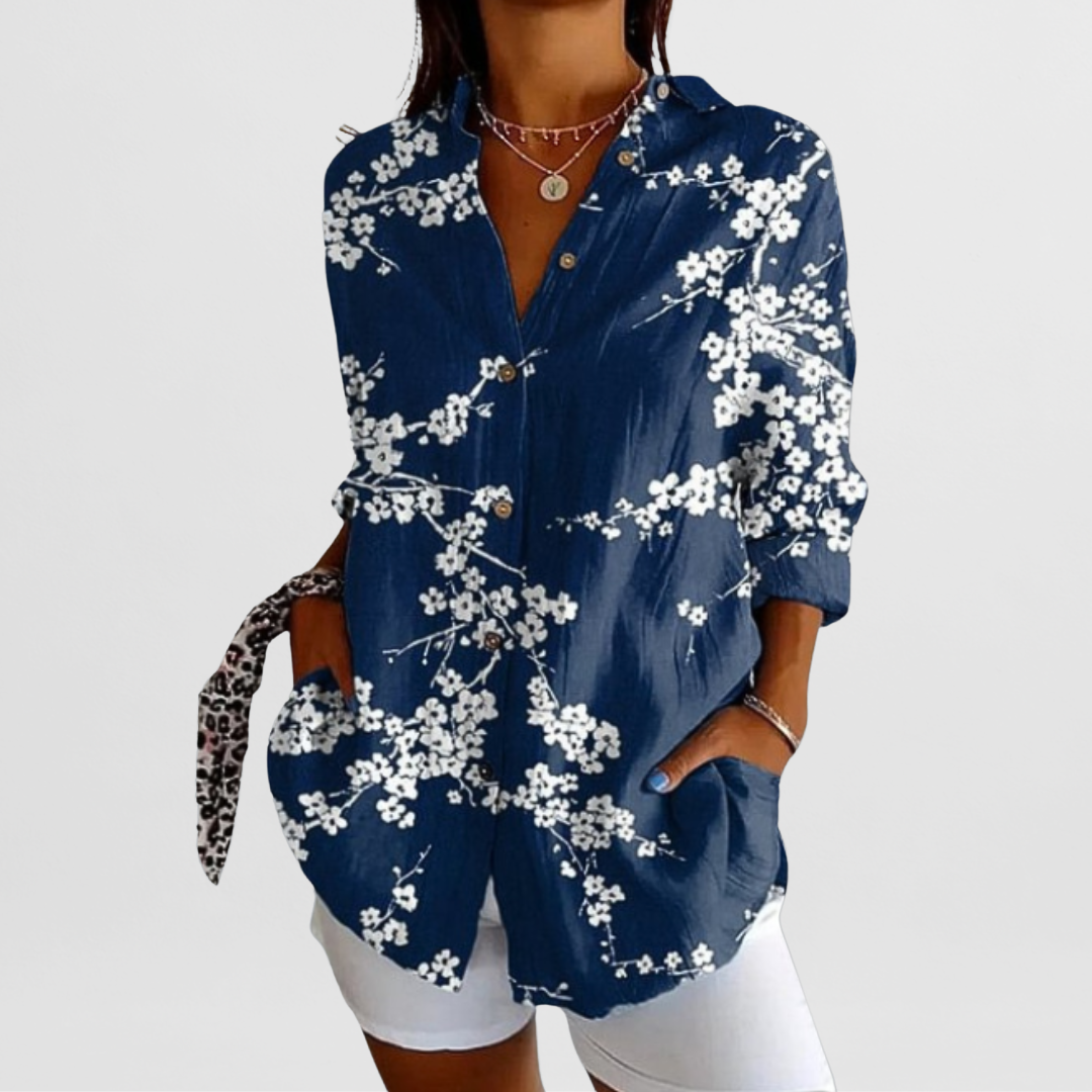 Elegant women's tropical floral blouse with loose fit and roll-up sleeves, ideal for spring & summer style.