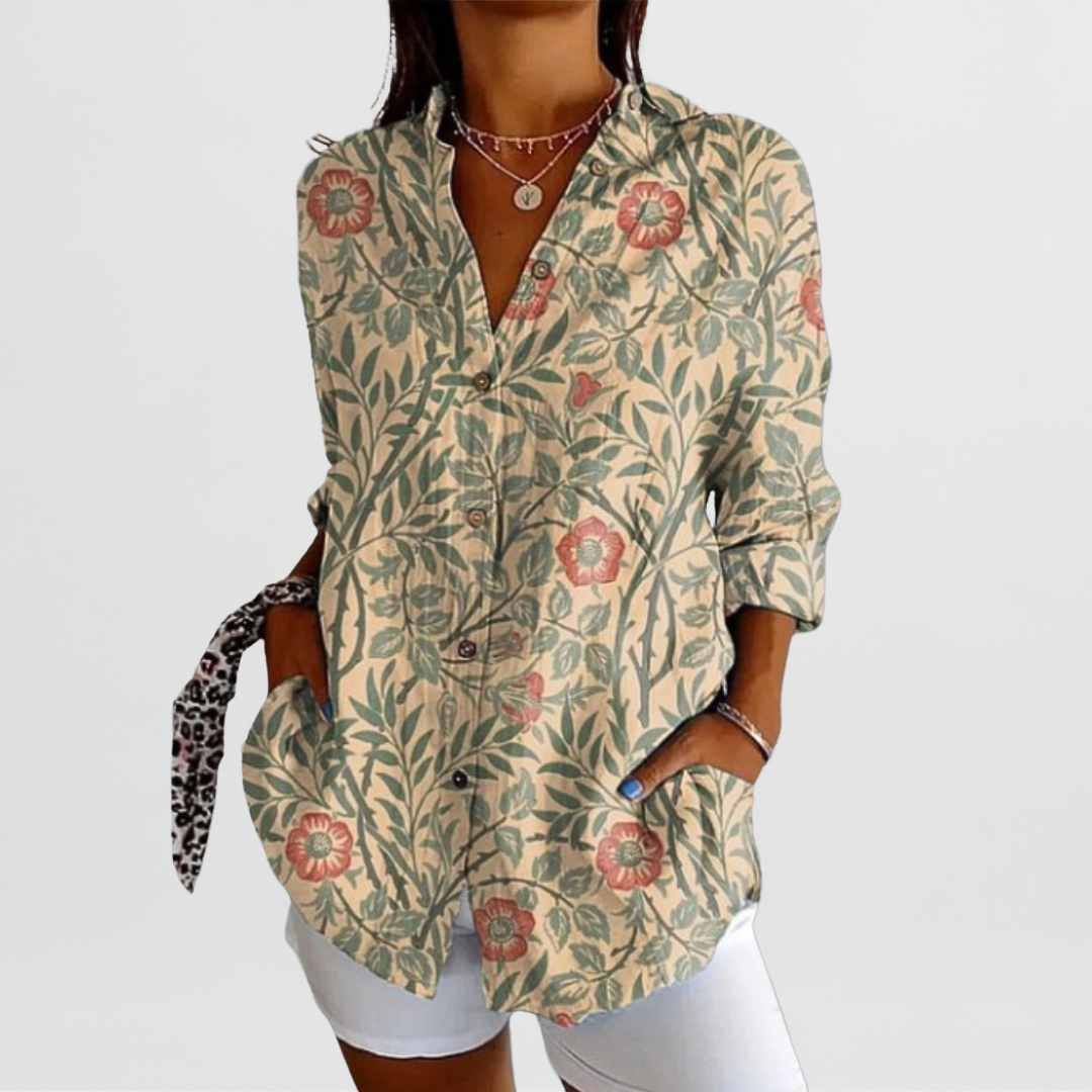 Comfortable loose fit women's tropical floral blouse, featuring vibrant summer patterns and stylish roll-up sleeves.