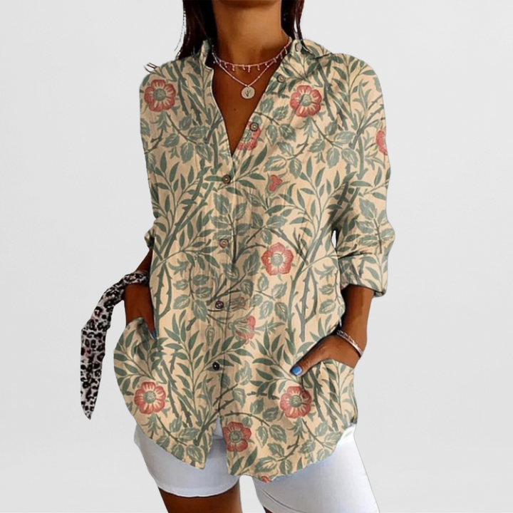 Comfortable loose fit women's tropical floral blouse, featuring vibrant summer patterns and stylish roll-up sleeves.