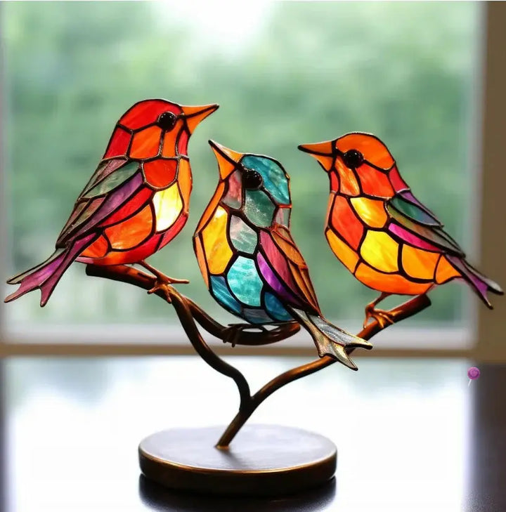 Decorative stained glass bird art for windows. A nature-inspired glass sun catcher bringing vibrant light & home accent.