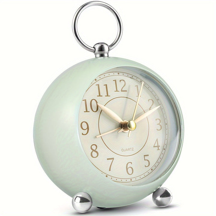 Vintage analog alarm clock with a quiet sweep movement and soft night light.