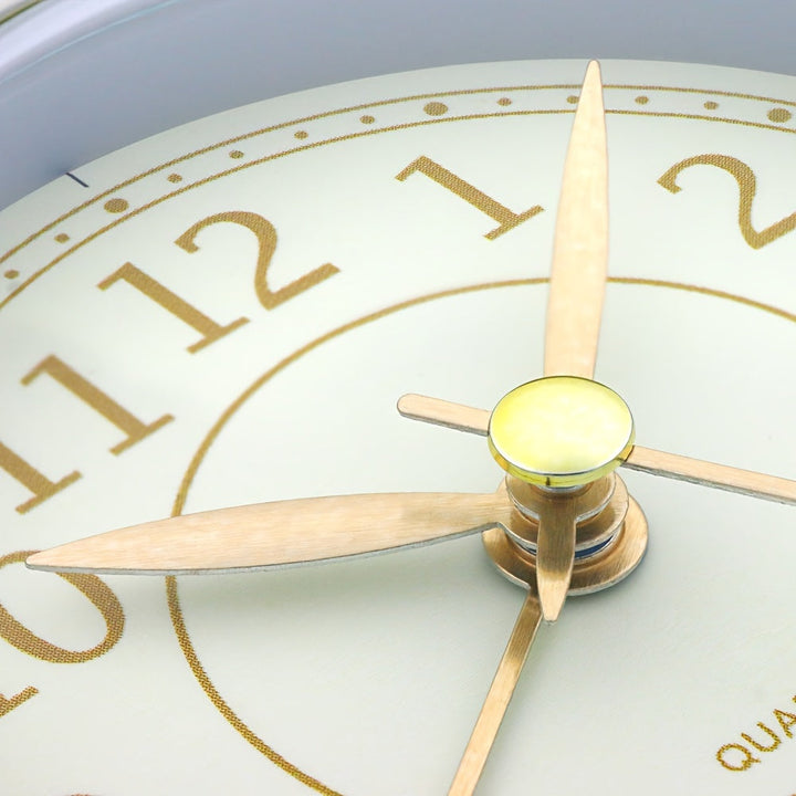 Compact retro alarm clock, analog, with a quiet motor and a built-in night light.