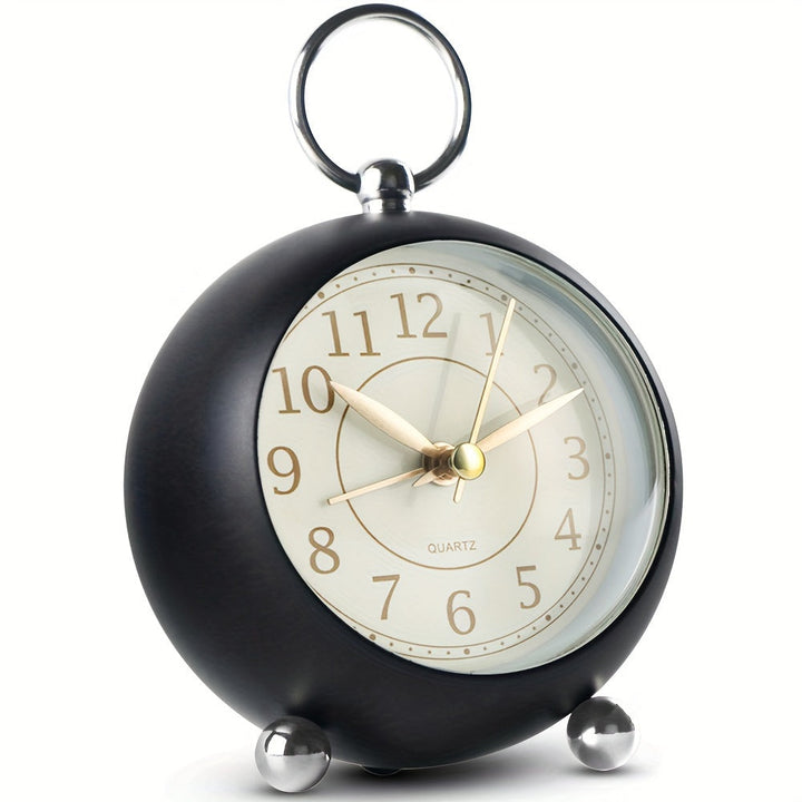 Readable vintage analog alarm clock, battery powered, with a quiet mechanism & night light.