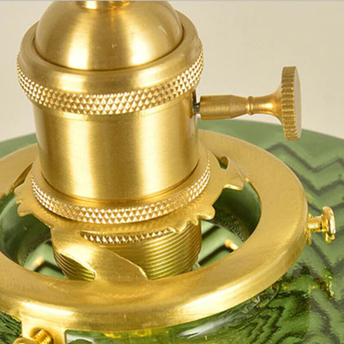 Vintage cylindrical glass pendant lamp casting warm glow; elegant centerpiece for home decor. Perfect for living and dining a