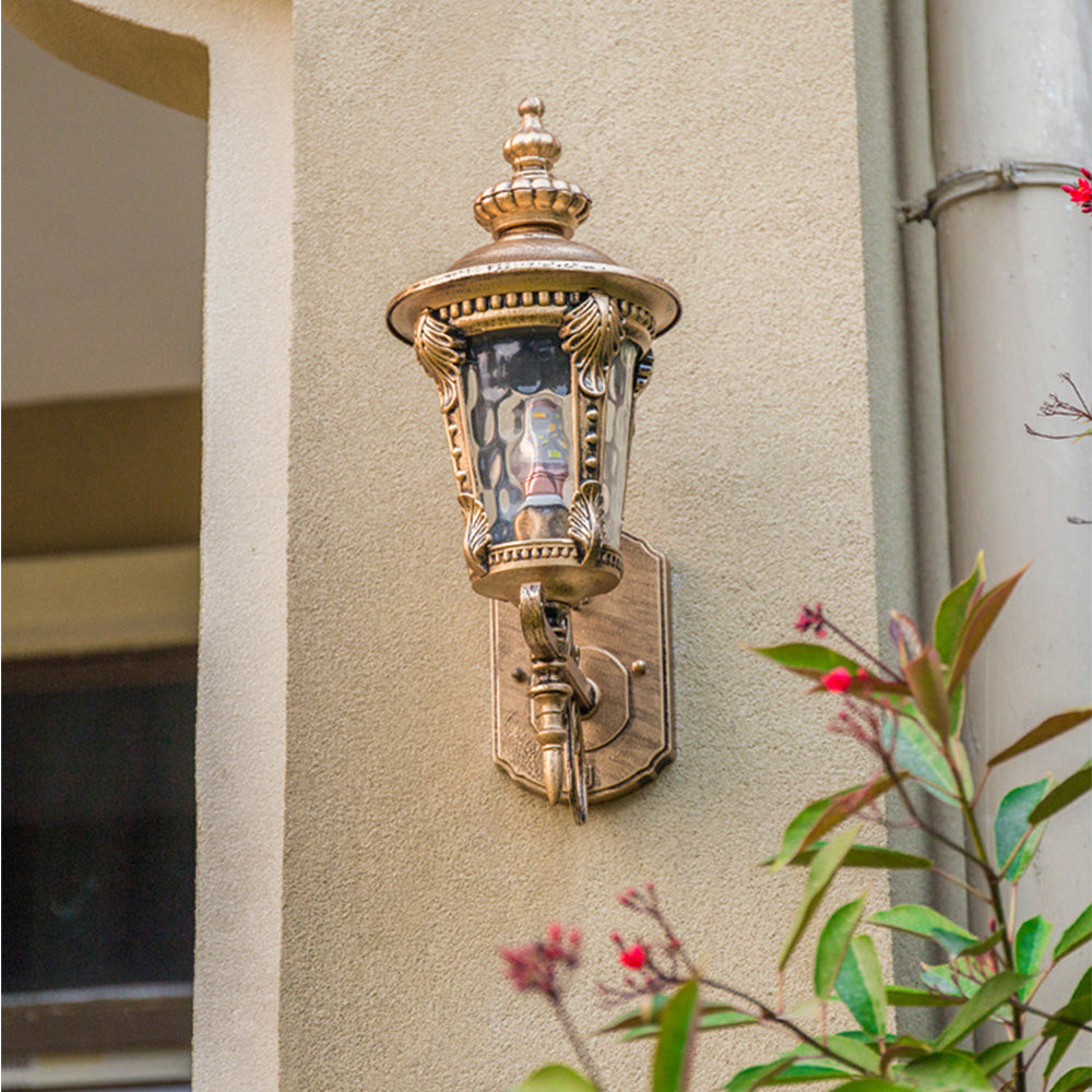 Rustic vintage wall lantern, aluminum frame, clear glass panels, suitable for outdoor use.