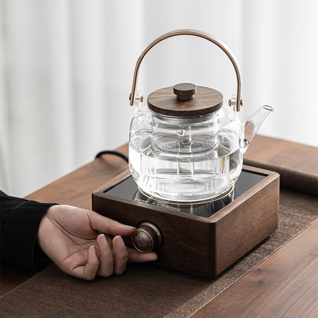 Compact walnut electric tea warmer with infrared heating, keeps drinks warm with adjustable temperature.