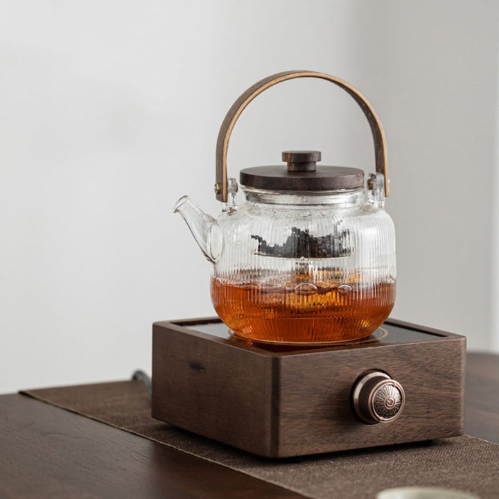 Top view: Sleek walnut electric tea warmer surface, ensures beverages stay hot. Adjustable heat control.