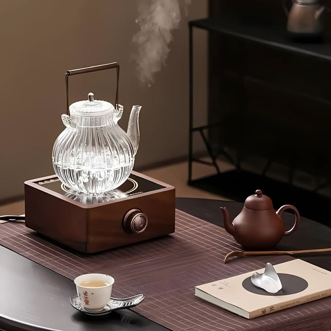 Enjoy hot drinks with this walnut electric tea warmer. Features adjustable temperature, a must-have tea accessory.