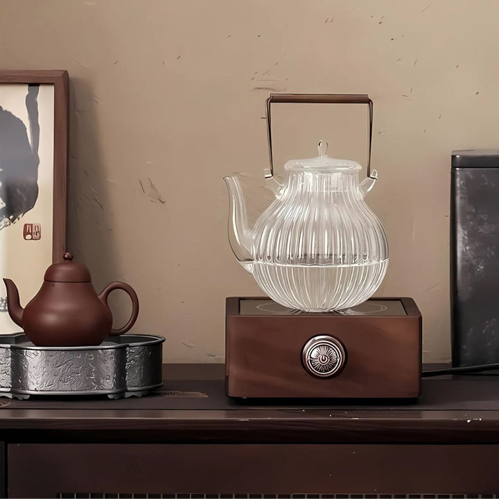 Versatile walnut electric tea warmer, a sophisticated tea & coffee accessory. Keeps beverages warm with ease.