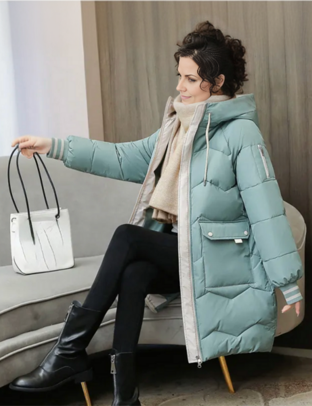 Elegant women's hooded long winter jacket, a warm puffer ideal for outdoor activities