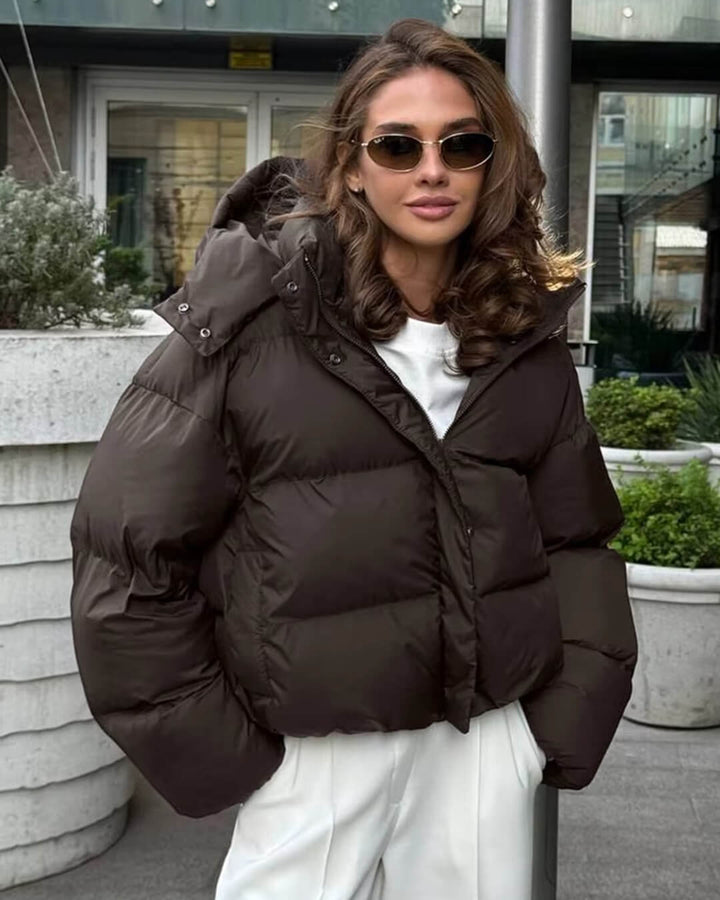 Warm women's hooded winter puffer jacket in black, ideal for everyday casual wear.