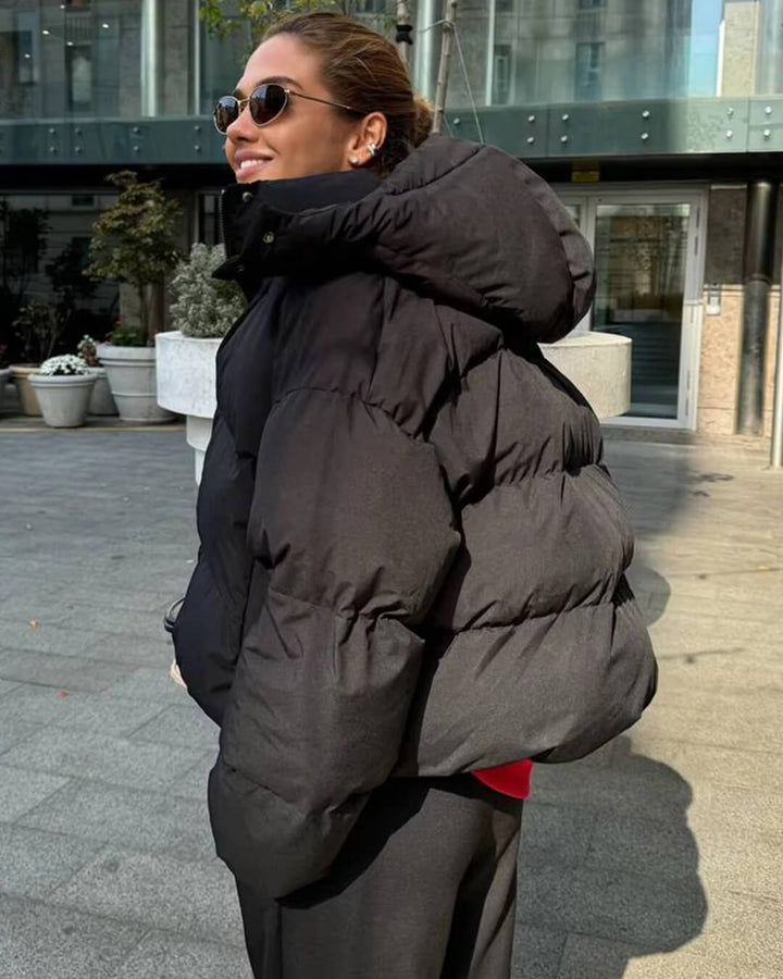 Stylish women's hooded winter jacket, a versatile puffer perfect for cold weather and casual outings.