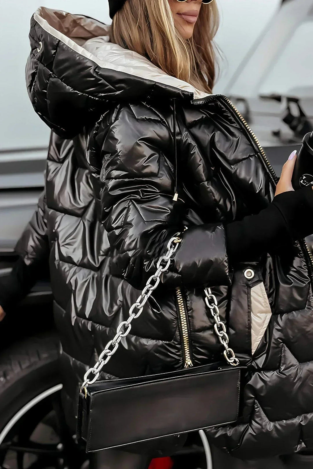 Comfortable women's long winter jacket for cold weather, padded and hooded, in a neutral color