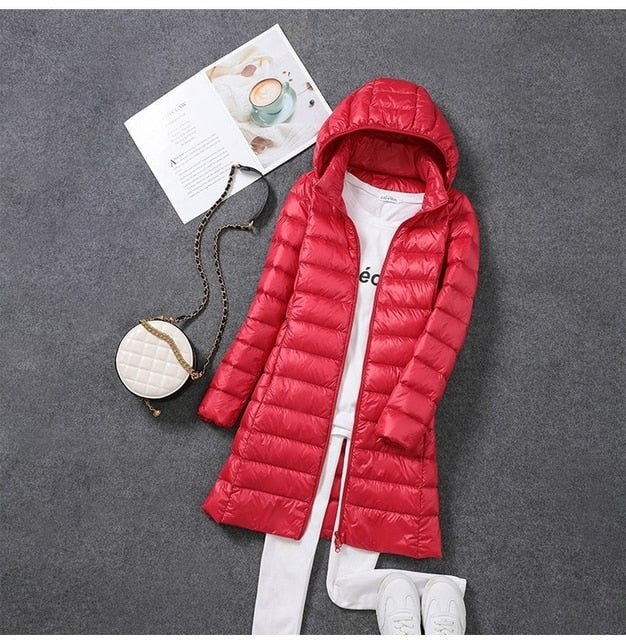 New women's water-resistant long puffer jacket featuring a convenient detachable hood