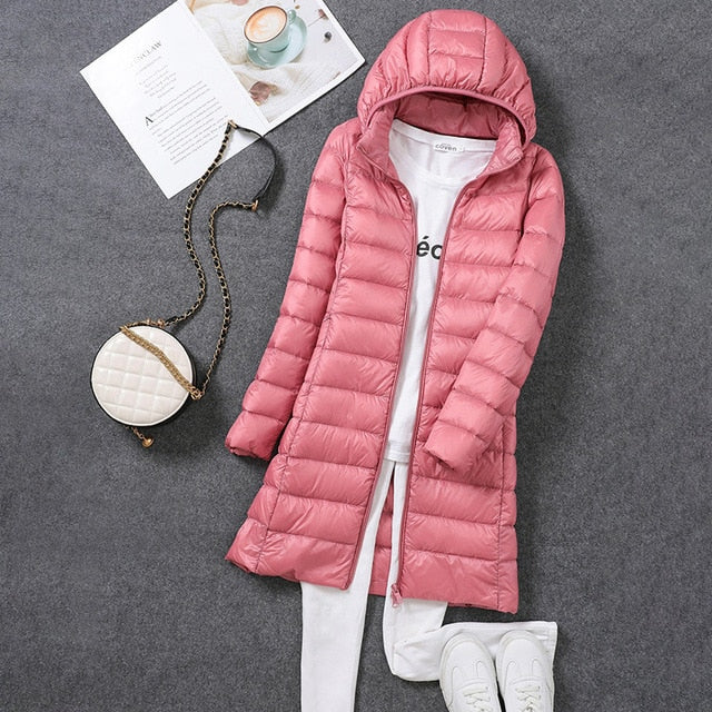 Close-up of the detachable hood detail on a women's long puffer jacket, ideal for winter