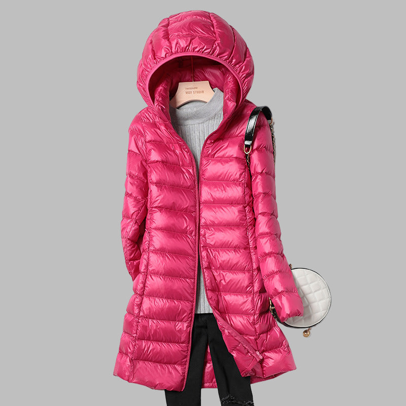 Women's long puffer jacket, a new winter coat with down fill offering warmth and an adjustable detachable hood