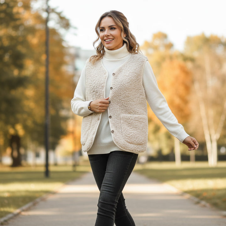 Warm women's sherpa vest in cream, perfect for casual spring layering and comfort.