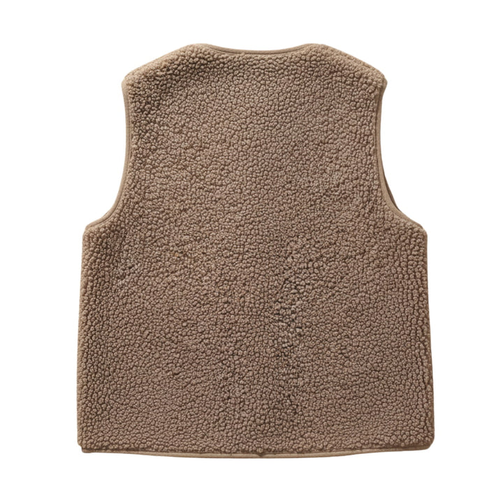 Close-up of plush sherpa material on a women's warm casual vest, showcasing texture.