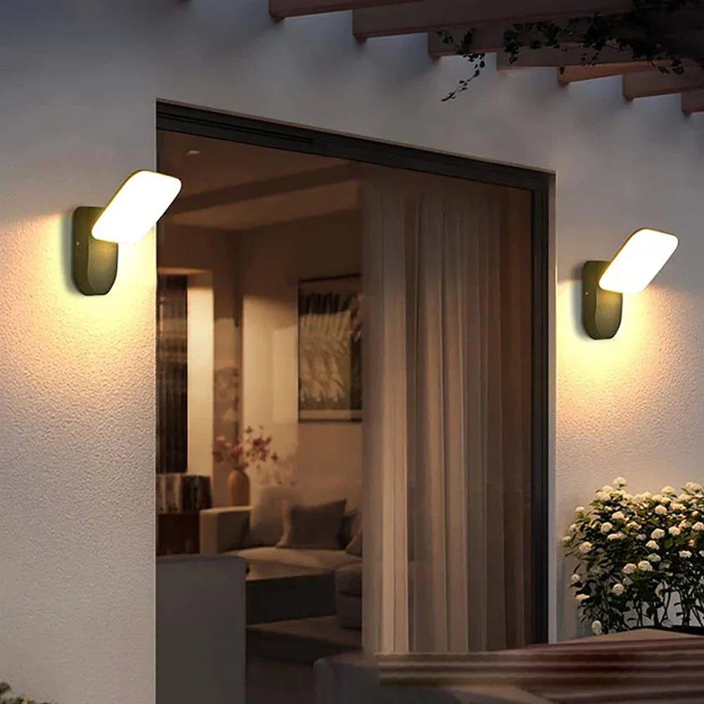 Waterproof outdoor LED wall light with PIR motion sensor, modern design, black aluminum, IP65 rated, enhancing exterior.