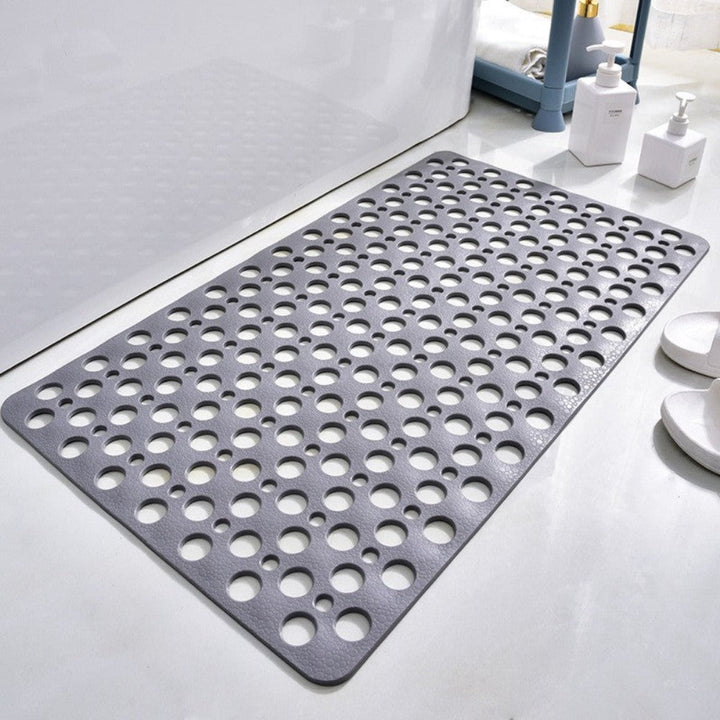 Flexible PVC bath mat with numerous suction cups on the underside for secure, anti-slip bathroom use