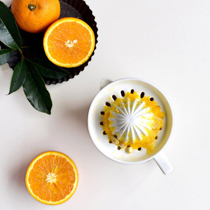 Essential ceramic hand juicer for home kitchens, making fresh juice from any citrus fruit simple.