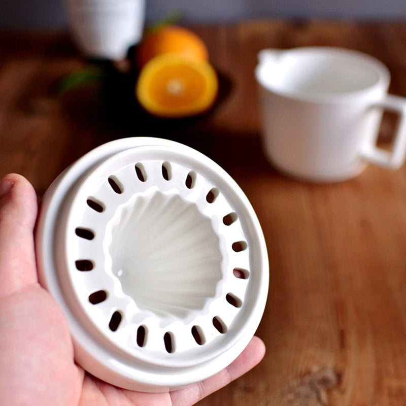 Ceramic lemon and orange hand juicer for extracting delicious fresh juice. A durable kitchen essential.
