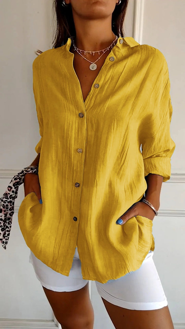 Women's apparel: long sleeve cotton blend button-down shirt, suitable for various casual outfits.