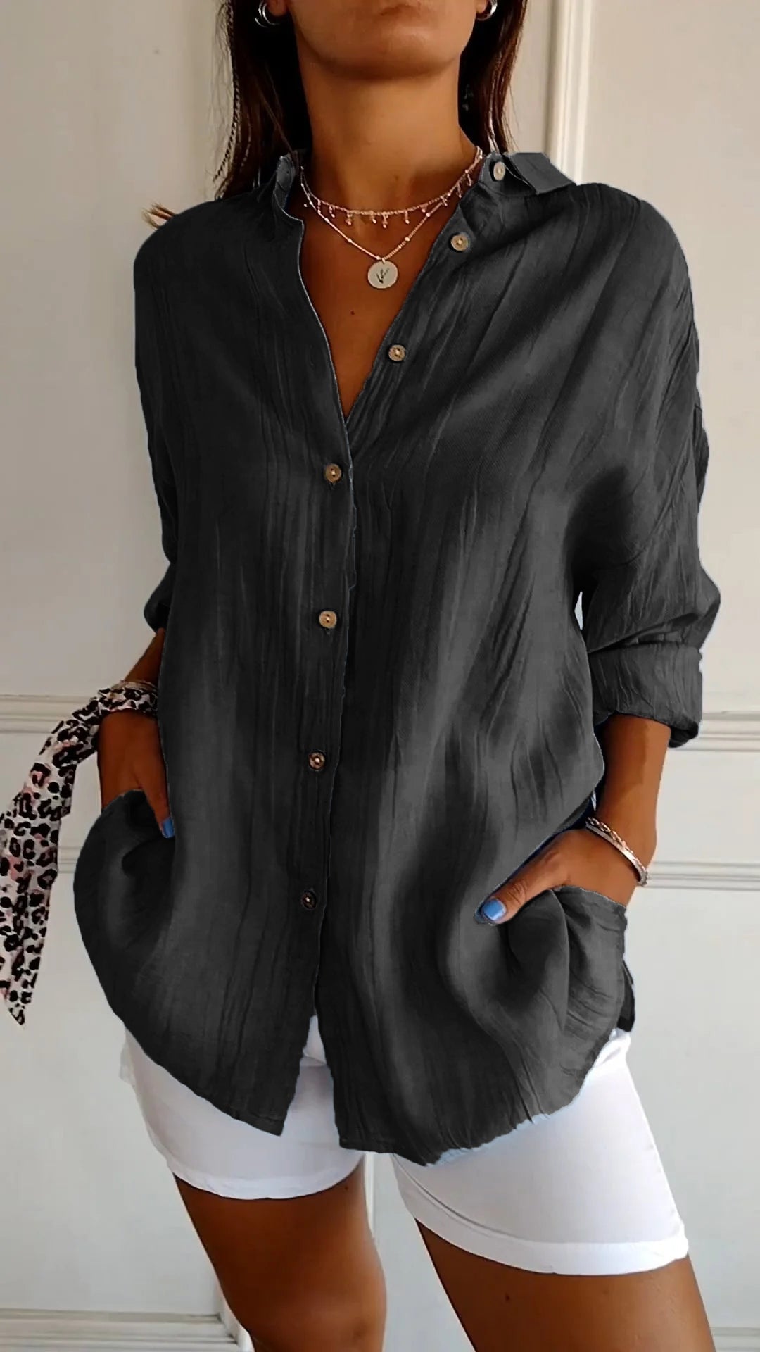 Casual chic women's button-down shirt in a soft cotton blend, featuring a classic collar.