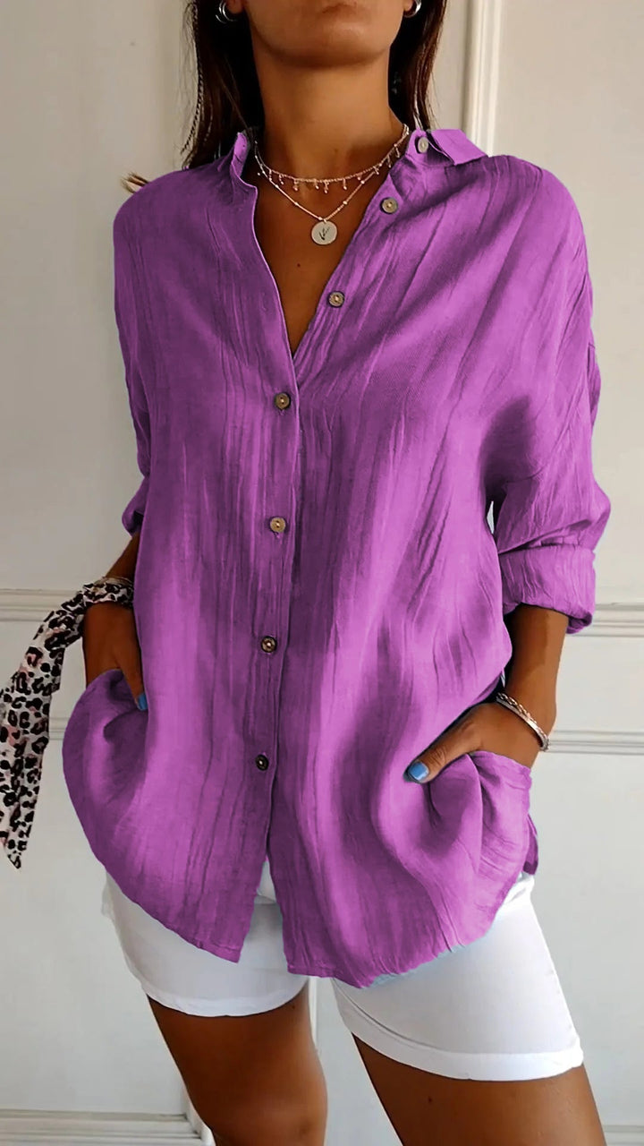Close-up of the fabric texture on a new women's cotton blend casual button-down shirt.