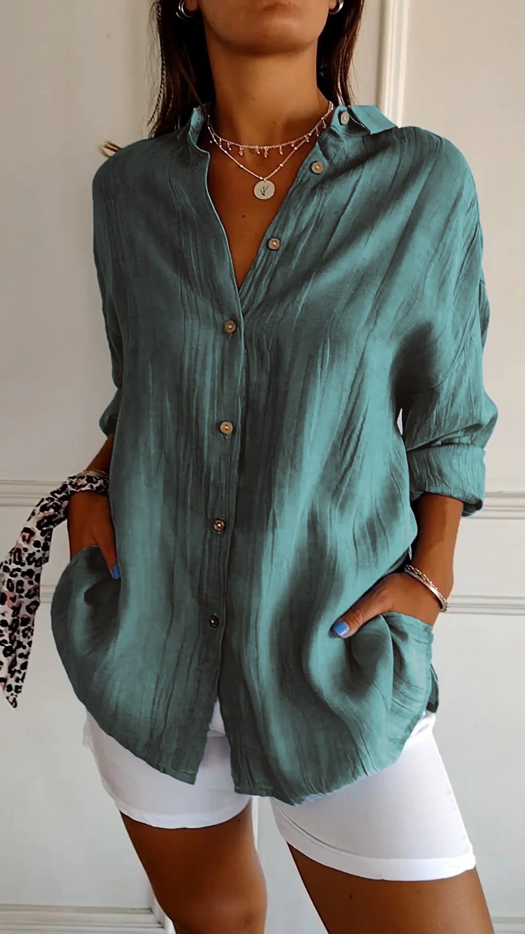 Back view of a women's versatile cotton blend button-down shirt, new and ready for wear.