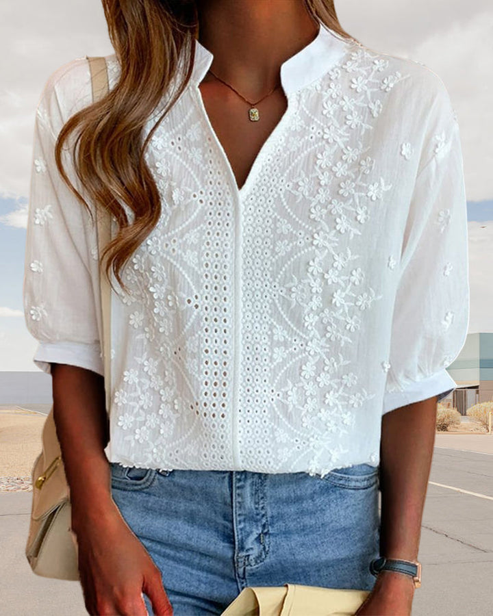 Casual white women's blouse with V-neckline and fashionable puff sleeves, ideal for summer