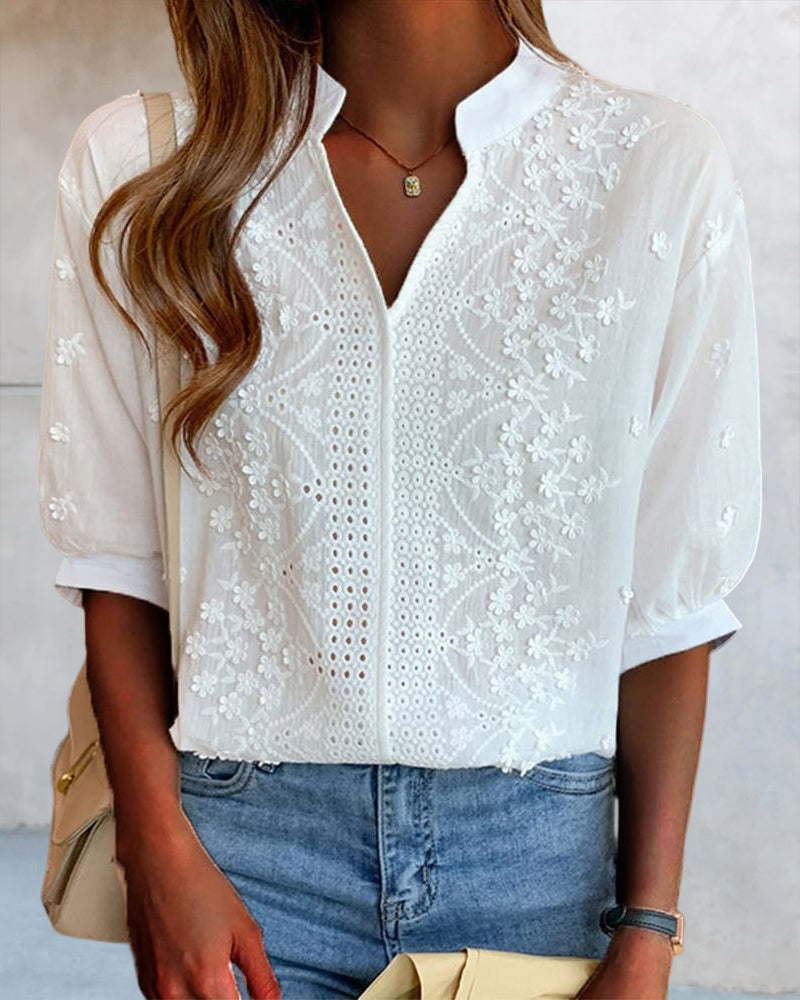 Stylish white V-neck blouse for women, designed with chic puff sleeves for a casual look