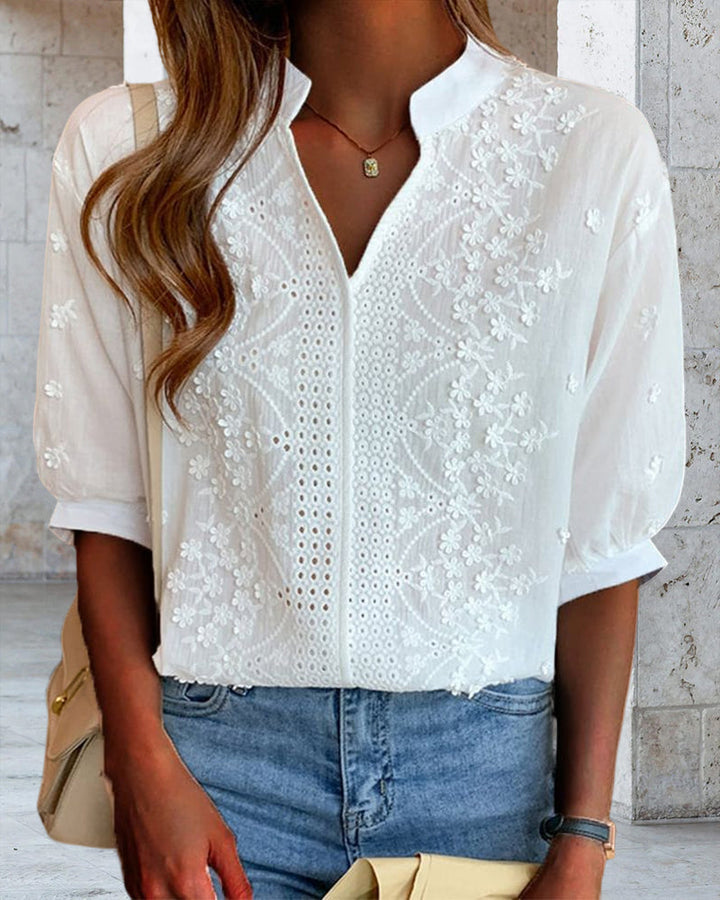 Comfortable women's apparel: white V-neck blouse featuring fashionable puff sleeves